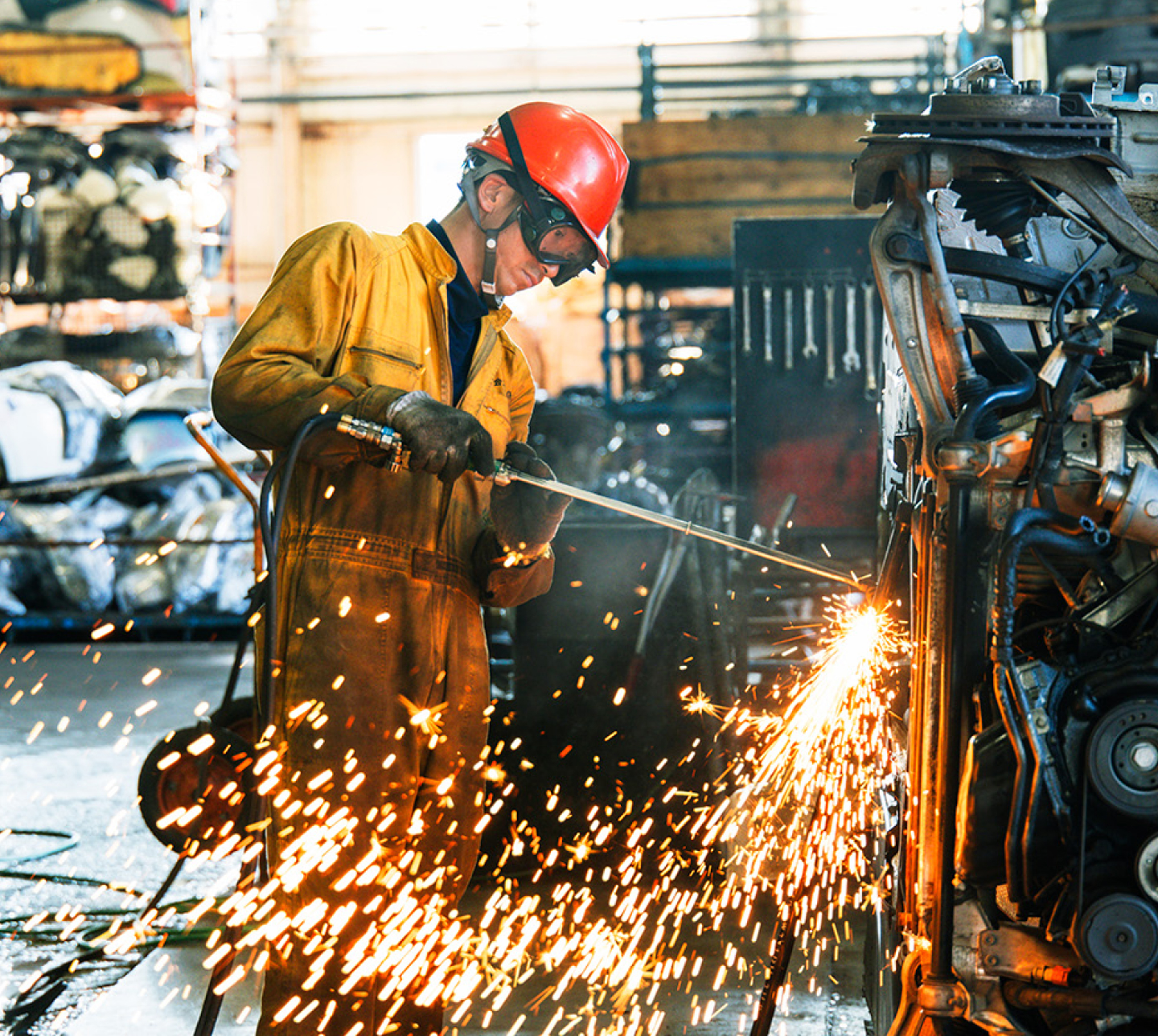 Staff dismantling cars