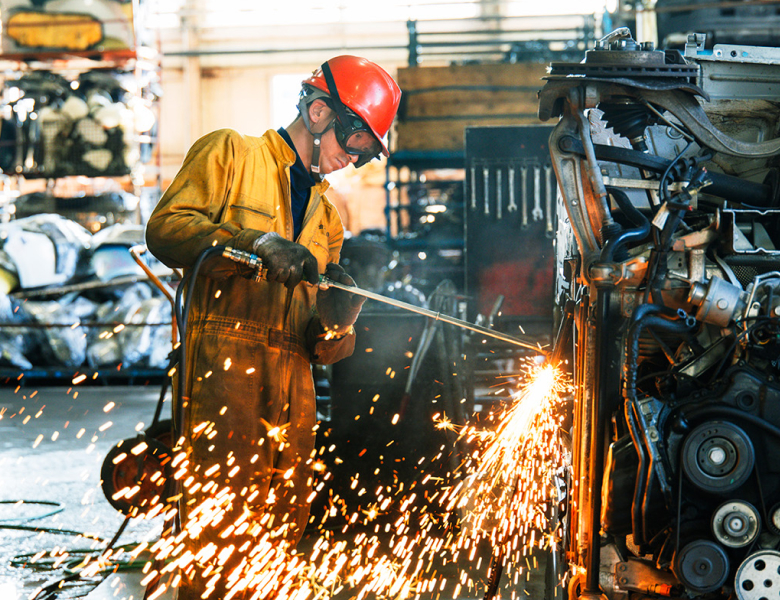 Staff dismantling cars